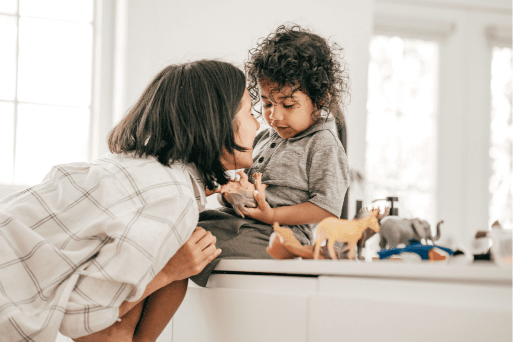 baby on counter mom leans in
