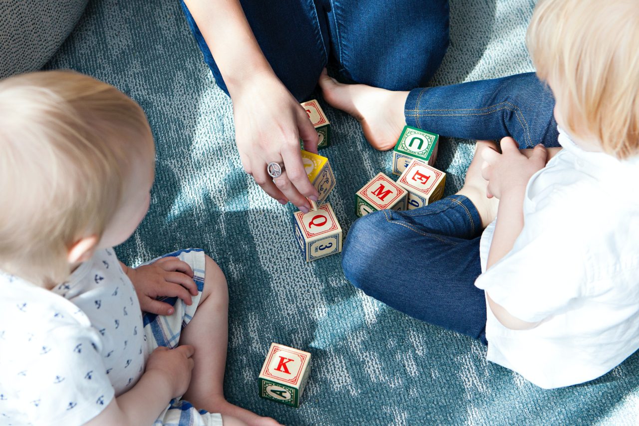 parent and children play with blocks