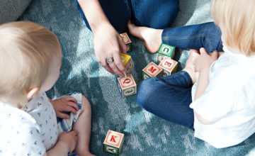 parent and children play with blocks