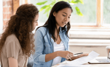two women discuss meeting