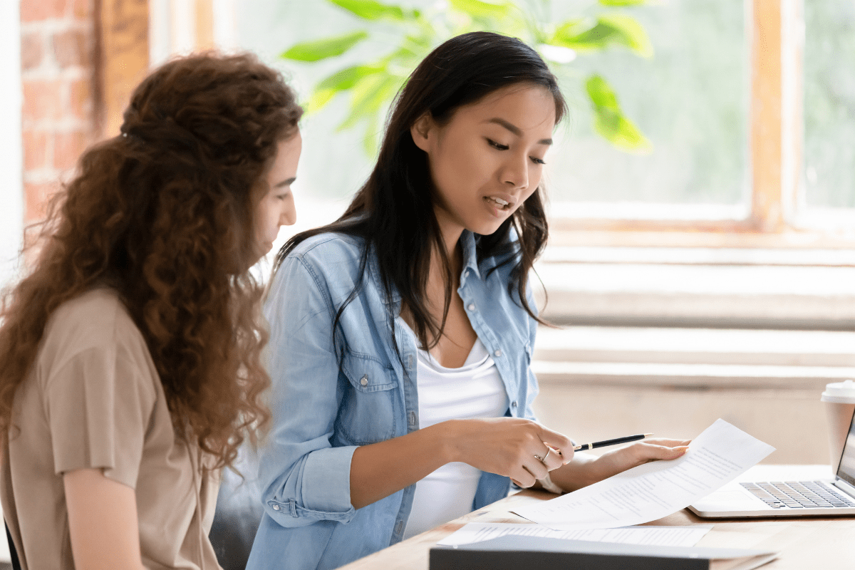 two women discuss meeting