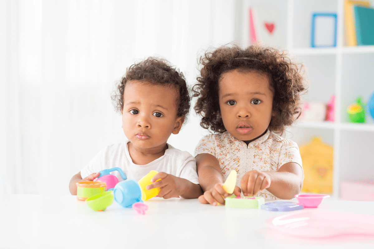 two children with toys