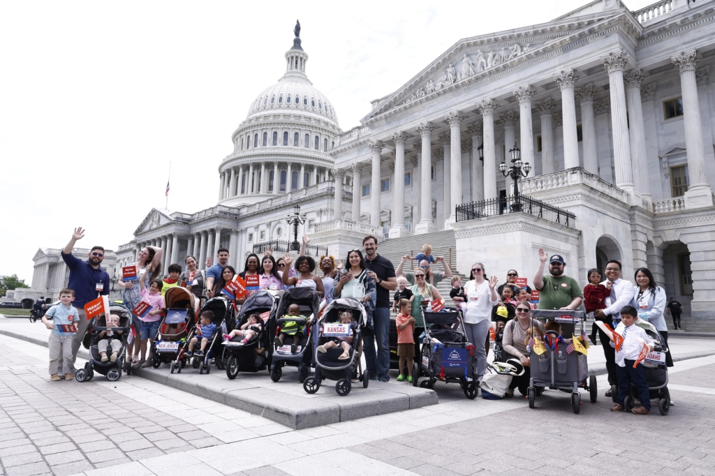 Group photo of Strolling Thunder families in front of the U.S Capitol building.
