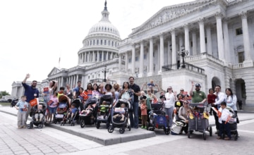 Group photo of Strolling Thunder families in front of the U.S Capitol building.