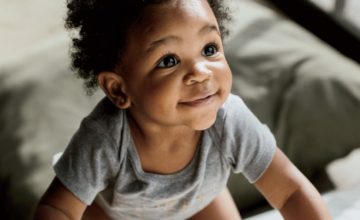 a baby learning to crawl