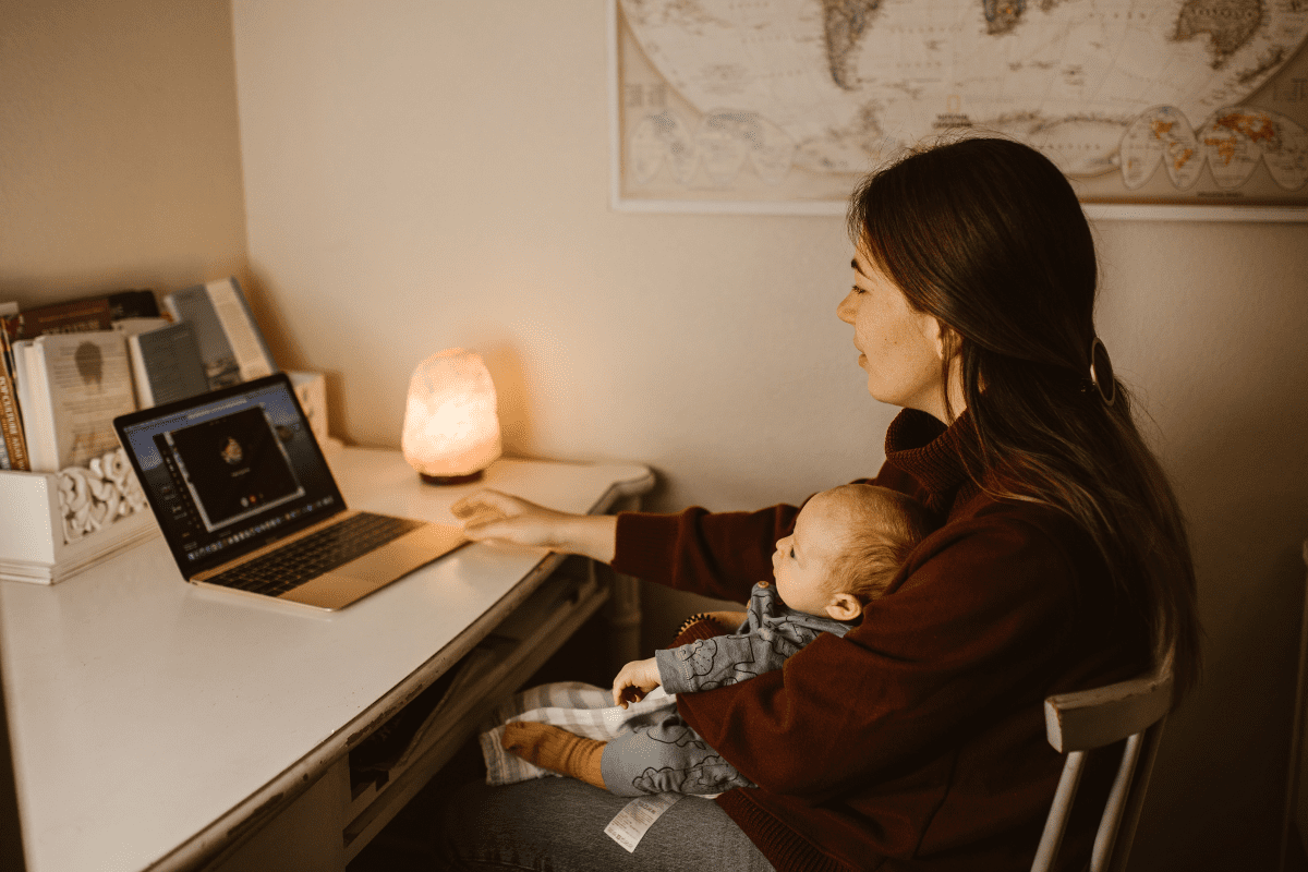 mom and baby facetime dad on laptop