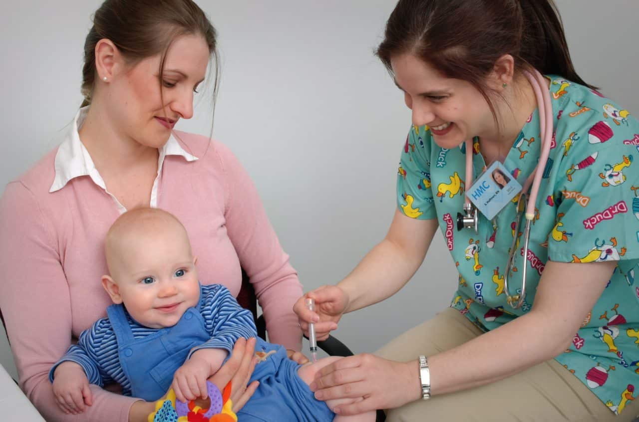 baby getting a shot at doctors