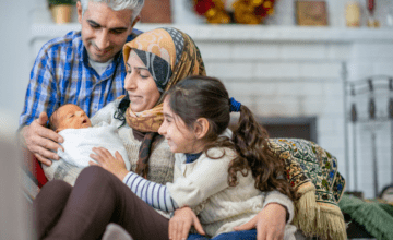 family watch newborn in house