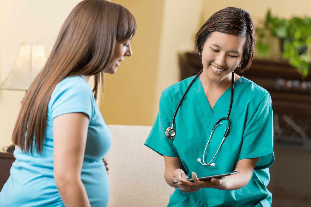 nurse talks to pregnant woman