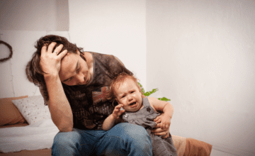 dad stressed baby crying