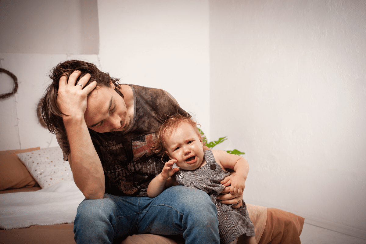 dad stressed baby crying