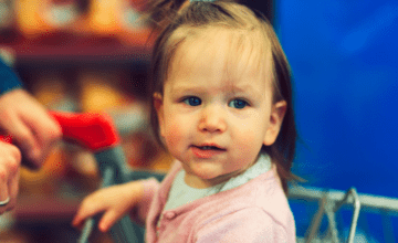 baby in shopping cart