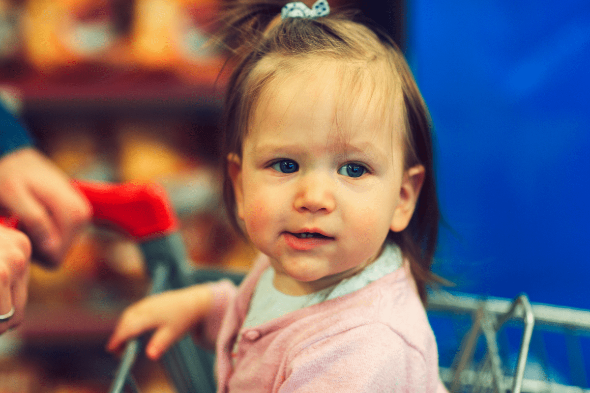 baby in shopping cart