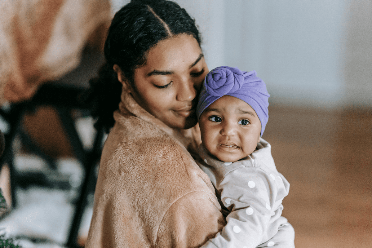 mom hugs concerned baby