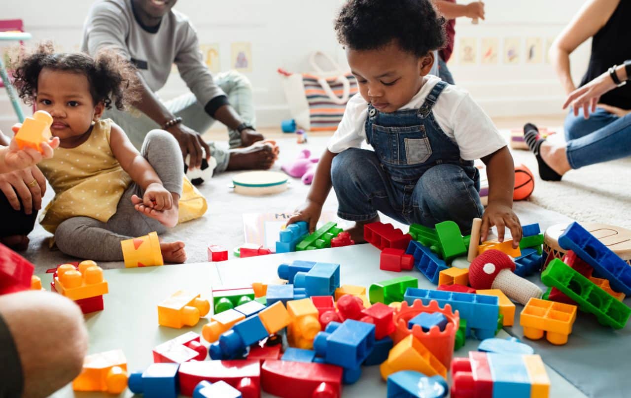 Toddlers playing with blocks