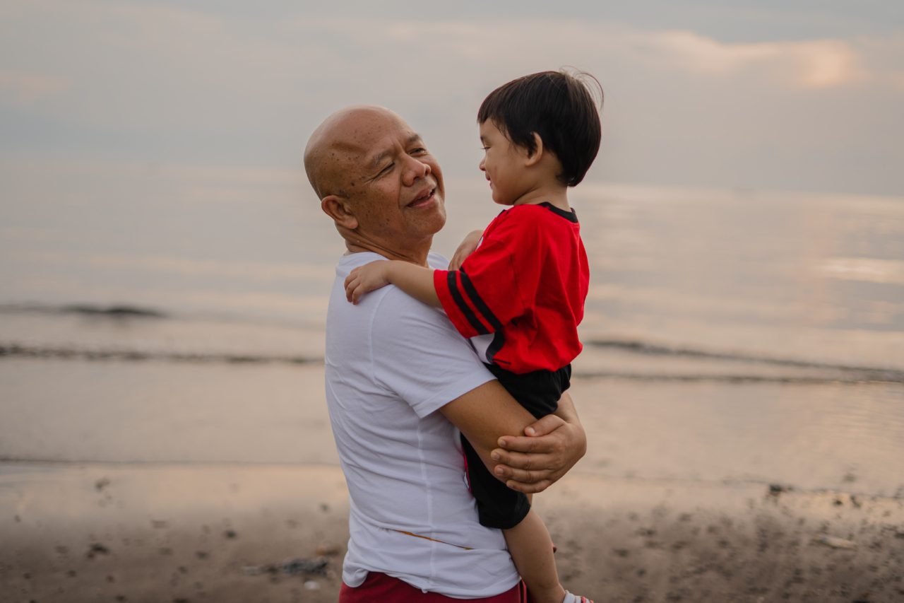 grandpa and grandson at the beach