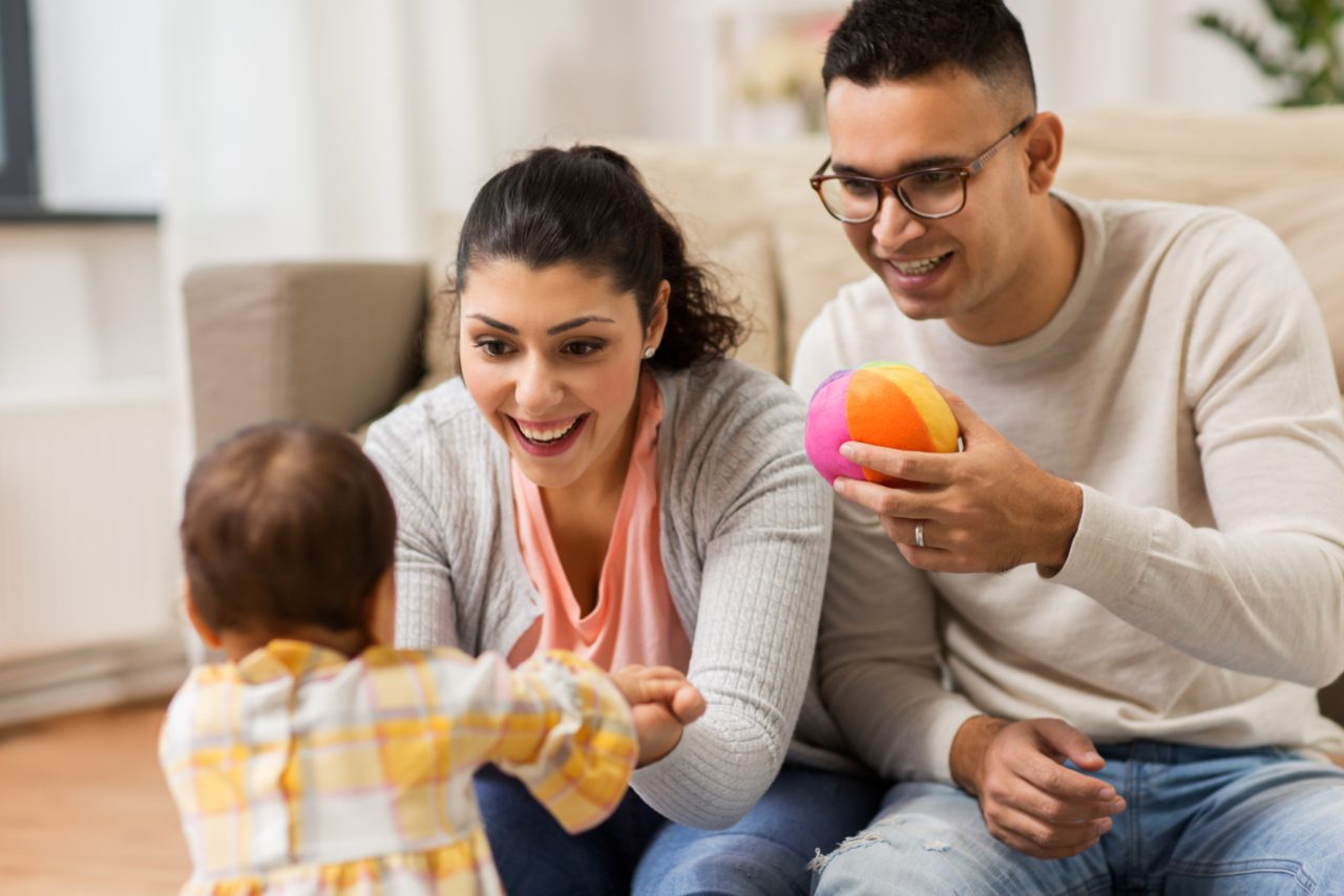 Parents playing with toddler