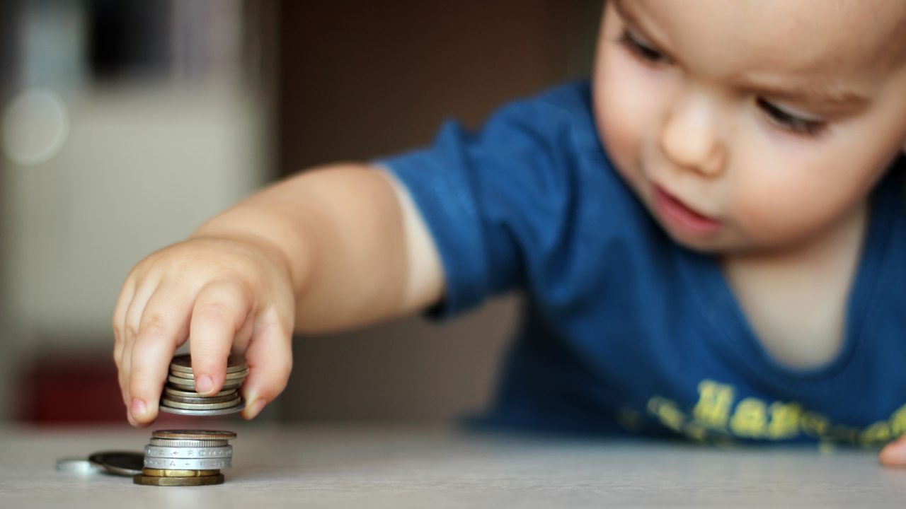 Baby playing with coins