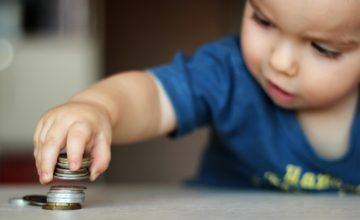 Baby playing with coins