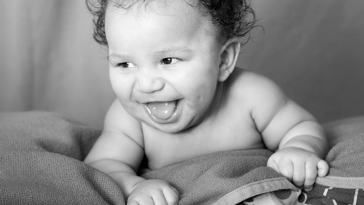 Happy baby smiling black and white photo