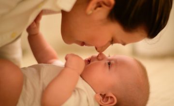 mom touches noses with baby