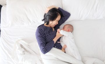Mom and baby in bed in the morning