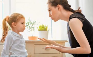 Woman talking to child looking at each other