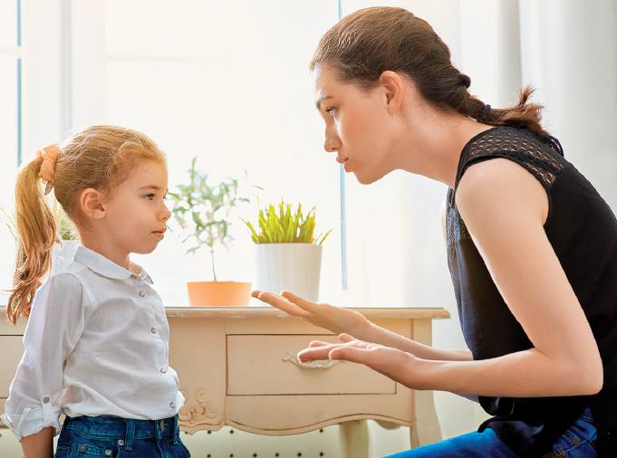 Woman talking to child looking at each other