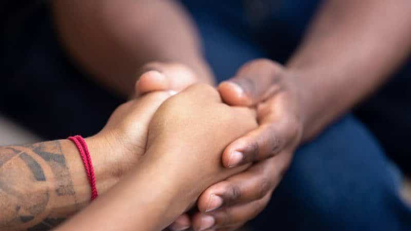 Couple holding hands