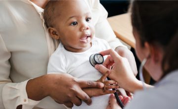 baby being checked by stethoscope