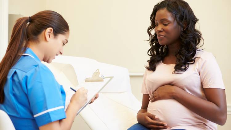 Pregnant mother seeing a doctor