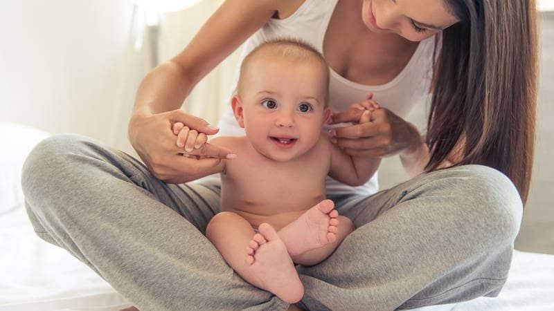 Mother Playing with Baby in Lap