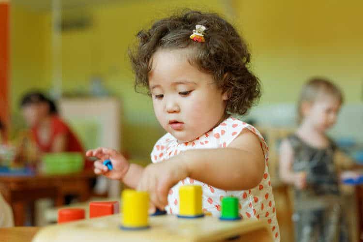 Toddler playing with toys