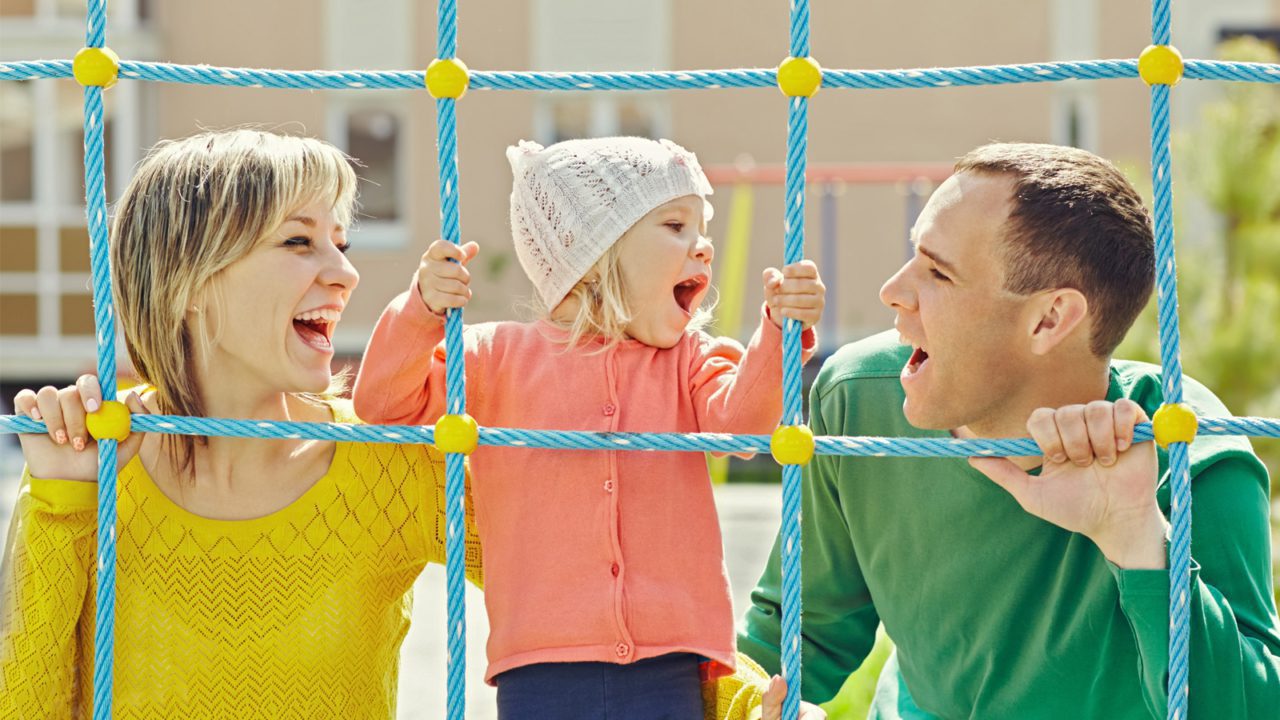 mother father and child playing at playground net