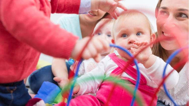 Mothers playing with their babies and their toys