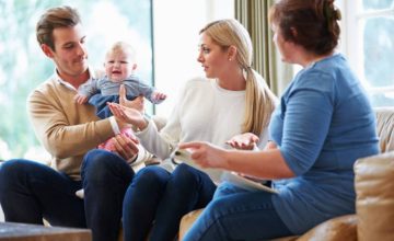 Parents with a baby during a home visit