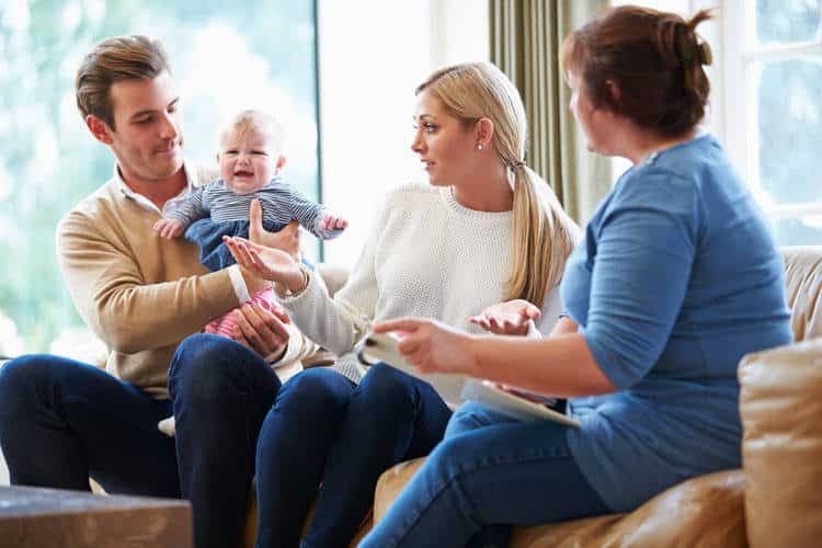 Parents with a baby during a home visit