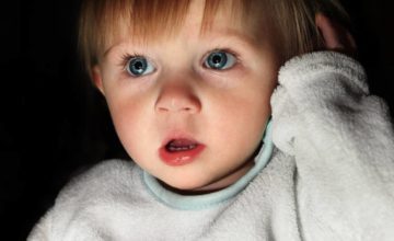 Photo of frightened 2 year old in the dark