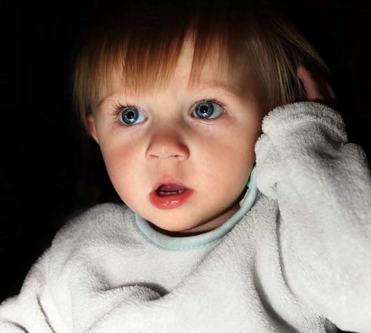Photo of frightened 2 year old in the dark