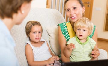 Mother with two children during a home visit