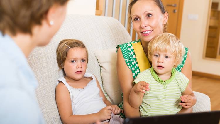 Mother with two children during a home visit