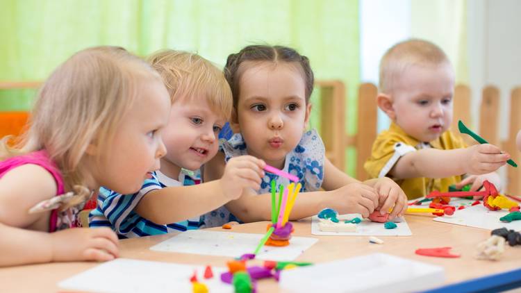 Toddlers in a group playing