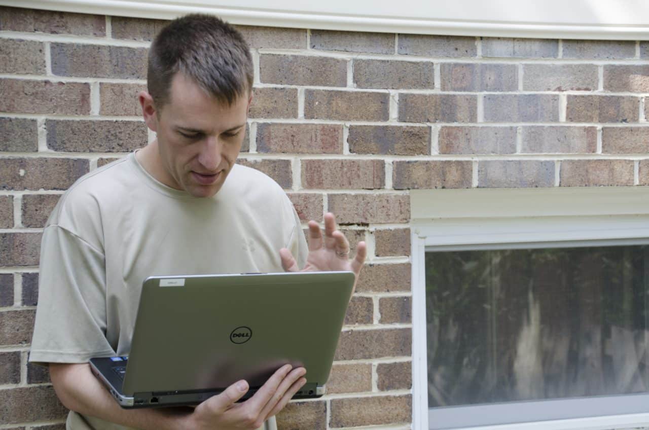 father talking to someone on the computer via video call