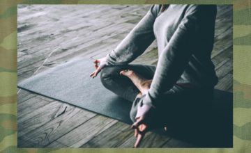 woman sitting in meditation pose with fingers touching