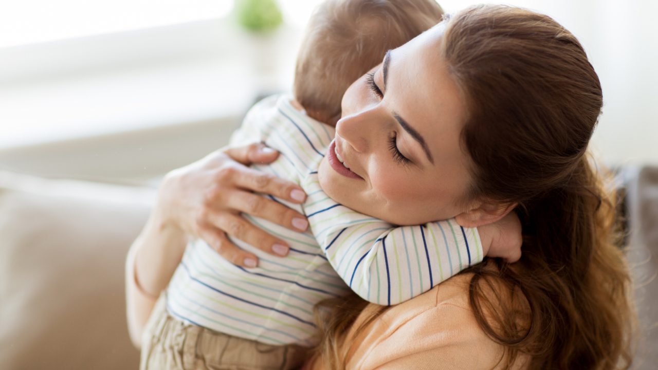 mother hugging baby