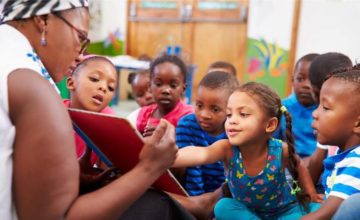 Teacher reading children a book