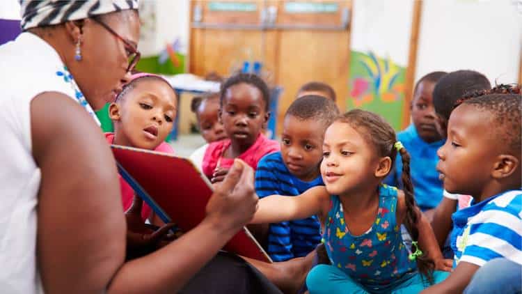 Teacher reading children a book