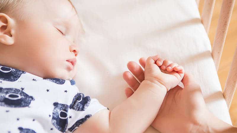 Infant Sleeping in Crib