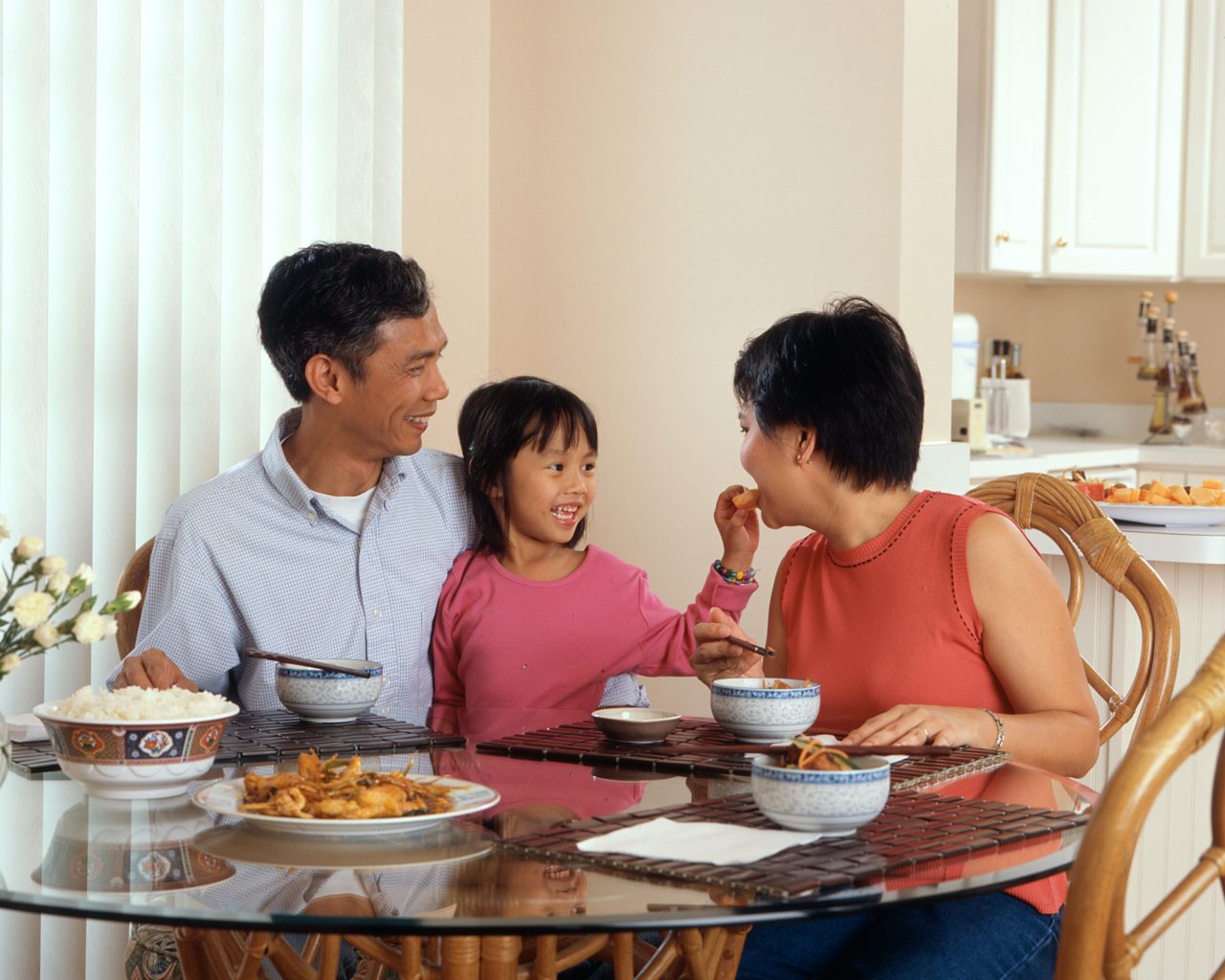 asian family eats dinner