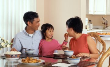 asian family eats dinner